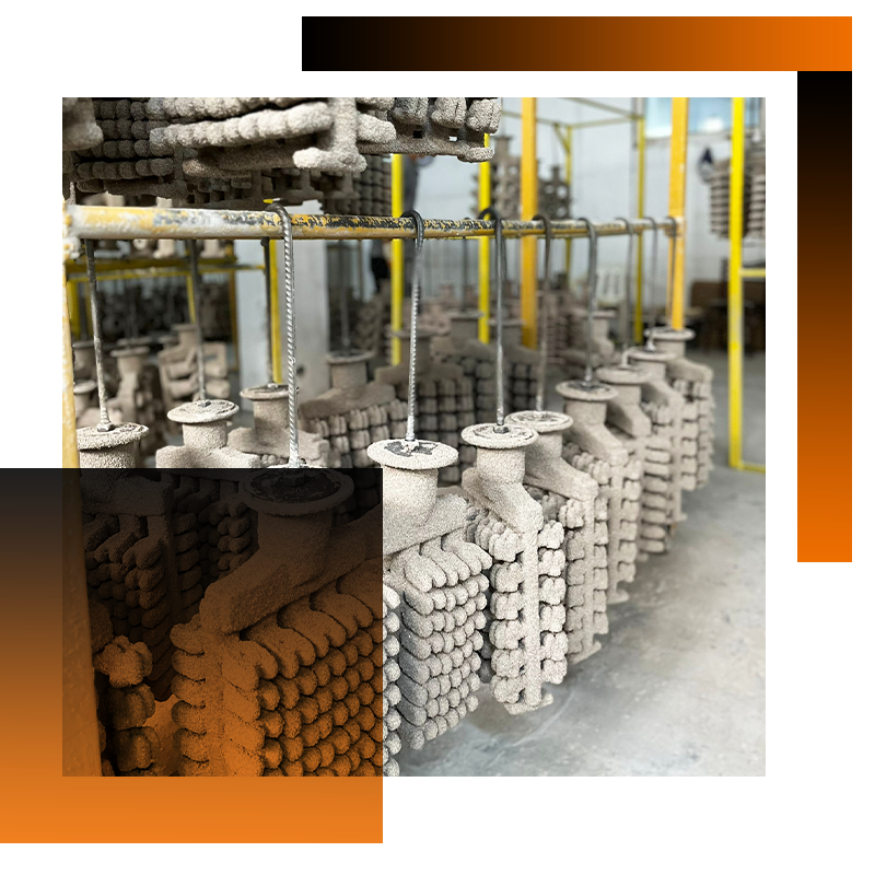 Investment casting shell tree with valve components drying in a manufacturing facility